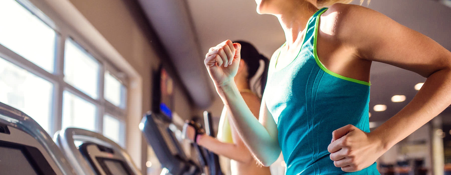 women on treadmills in gym
